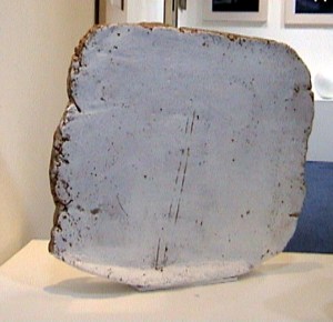 Ceramic clay sculpture, square, painted white with the clay exposed at the edges