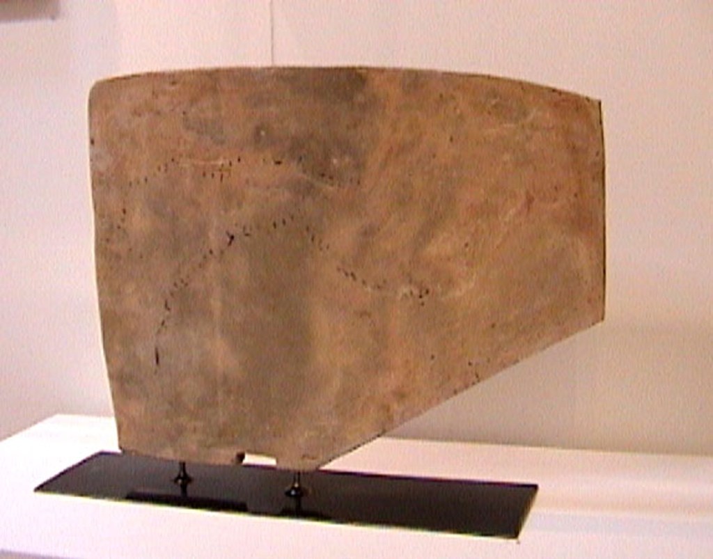 Abstract angular ceramic clay sculpture on steel base.