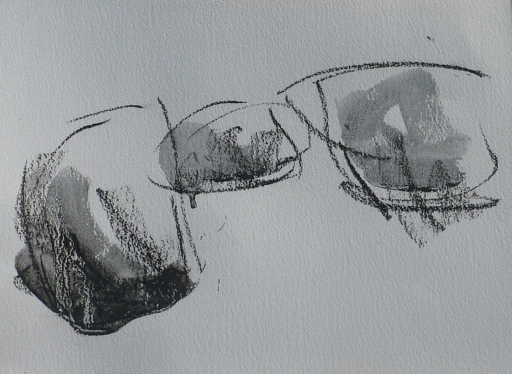 Monochrome painting of three clouds in ink with charcoal drawing