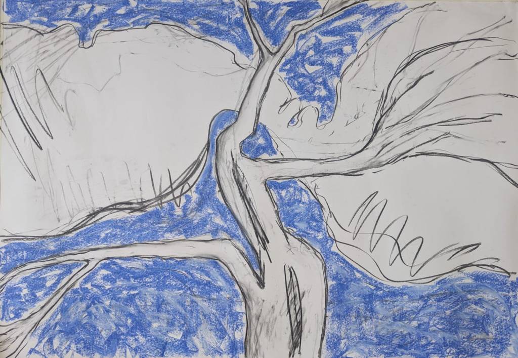 Drawing of tree against a blue sky with clouds